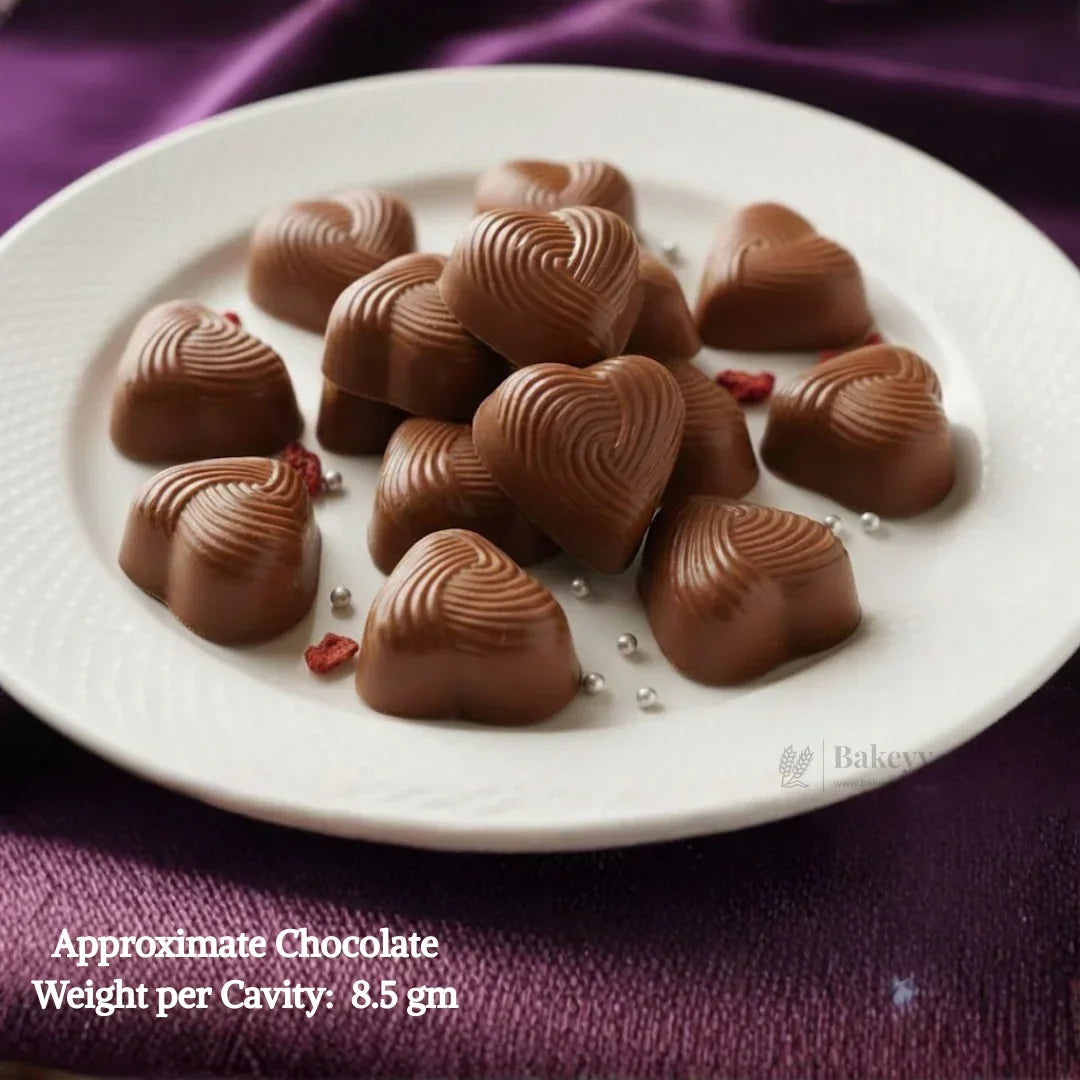 Mould275HeartShapeChocolateMouldwithLayeredSwirlTexture12CavityClearPlasticChocolateMouldTrayDecorativeChocolateMakingMouldPackof1_2 - Bakeyy.com