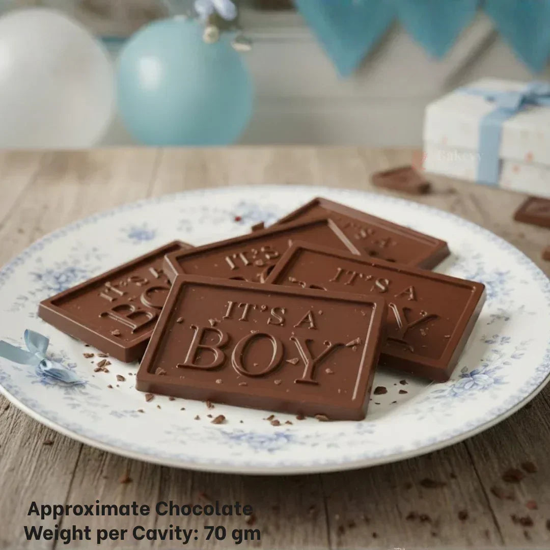 Bakeyy chocolate bars with 'It's a Boy' text on a plate, perfect for baby shower gifts.