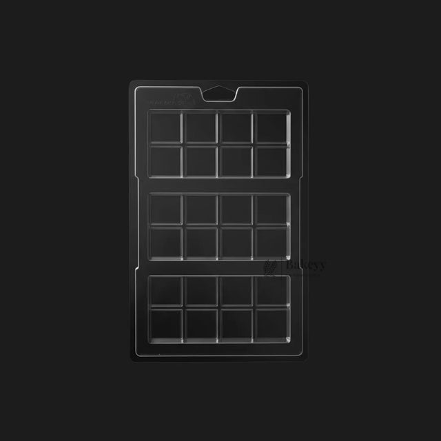 Clear plastic chocolate mould tray with 18 rectangular cavities for baking from Bakeyy.com