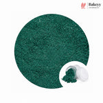 A circular close-up of sparkling dark green glitter powder, with a small inset showing the powder spilled from a clear jar with a white lid. The Bakeyy logo appears in the top right on a white background.