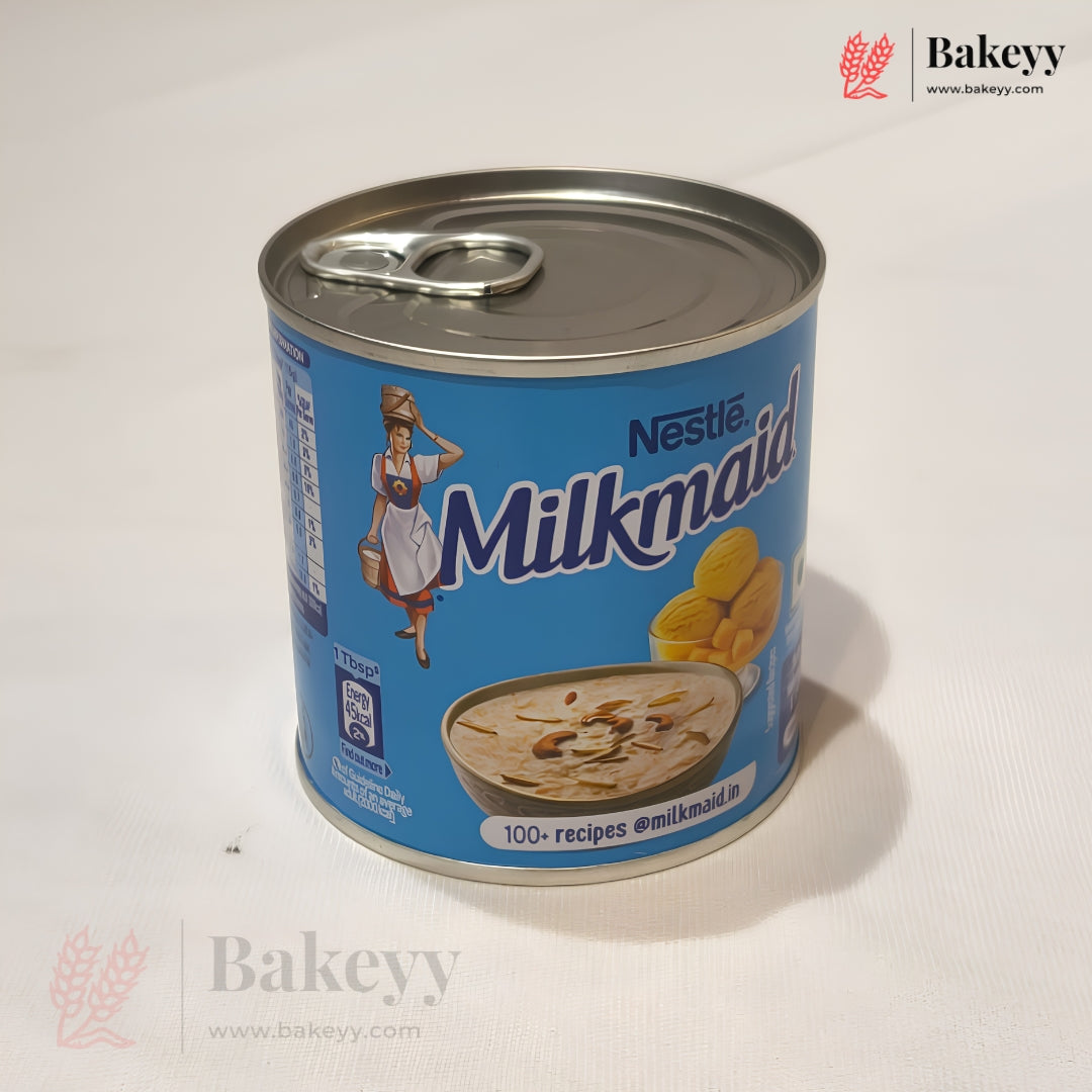 A can of Nestle Milkmaid Indian Sweet Bread (Dosa) on a white surface, showing the blue packaging with the brand logo and product illustration.