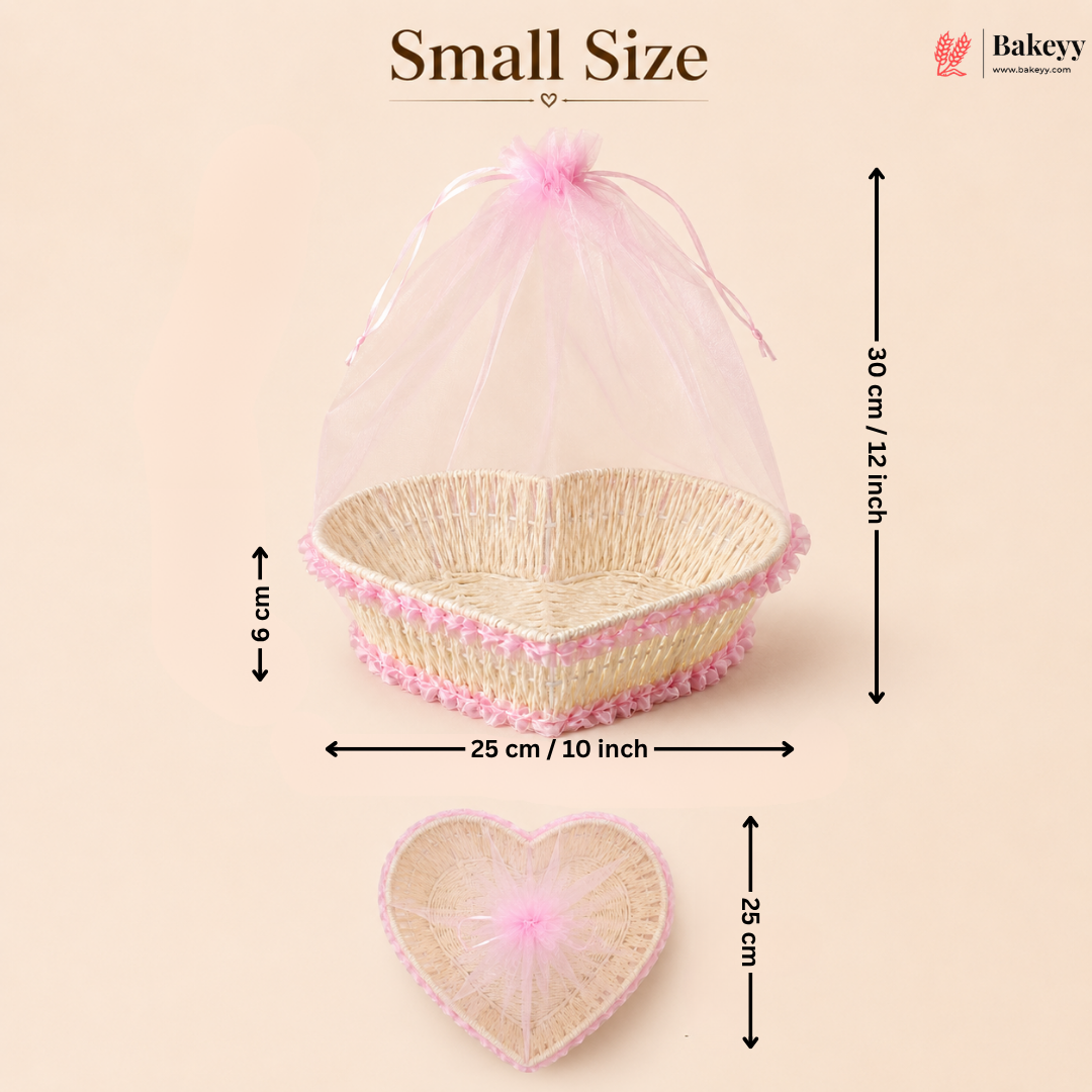 Small size heart-shaped wicker basket with pink mesh cover and measurements on a beige background