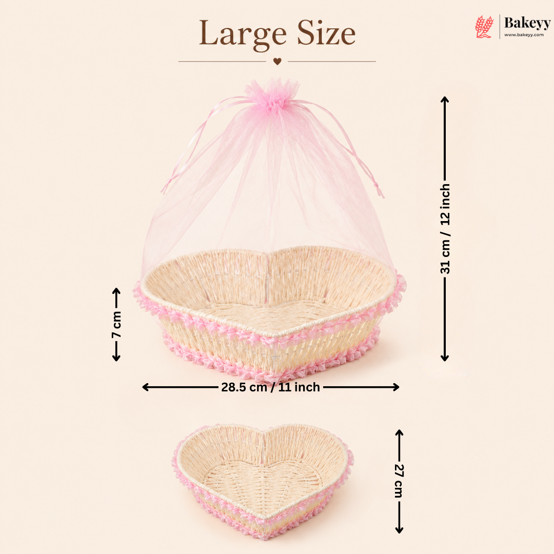 Heart-shaped wicker basket with pink mesh cover and measurements on a beige background