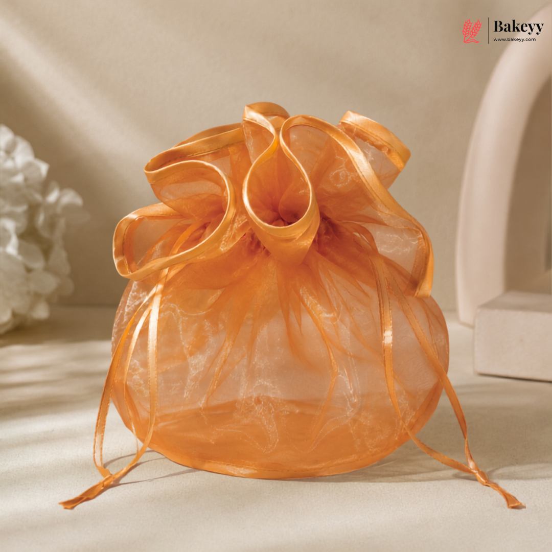 Orange organza bag on a light background with 'Bakeyy' branding.