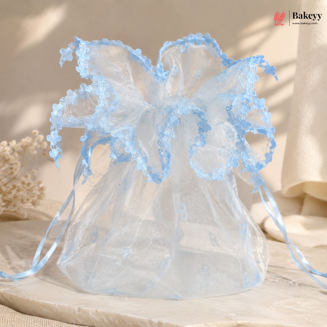 Decorative angel with blue wings on a neutral background
