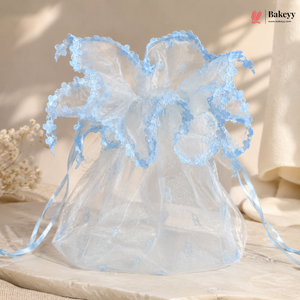 Decorative angel with blue wings on a neutral background