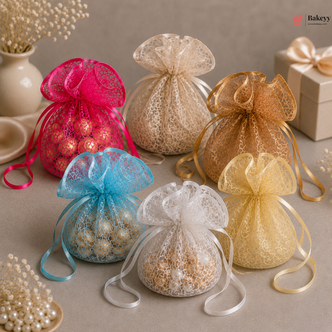 Colorful organza bags with ribbons on a neutral background