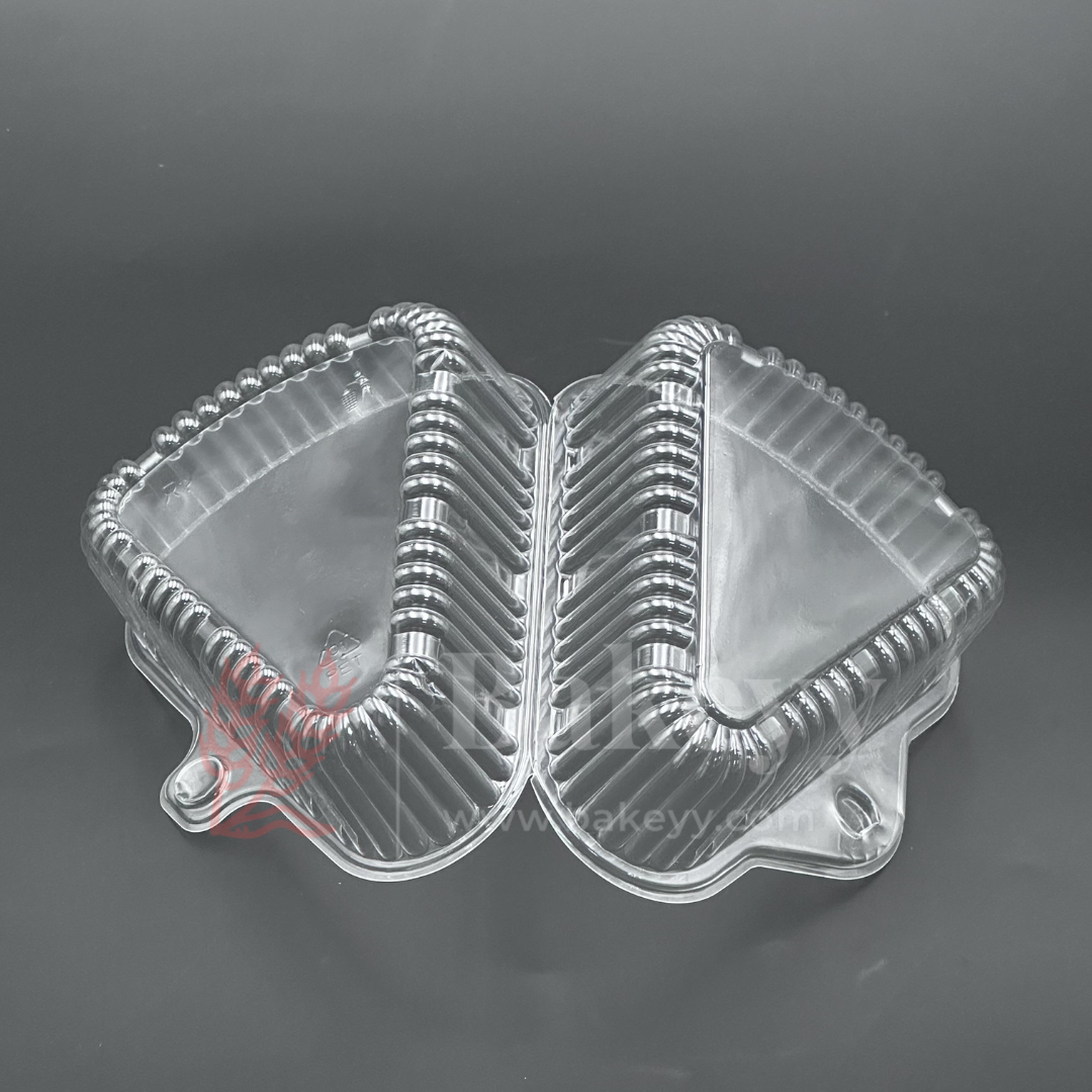 Clear plastic food container with a lid on a dark background