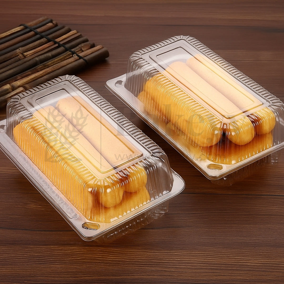 Two plastic containers with yellow pastries on a wooden surface