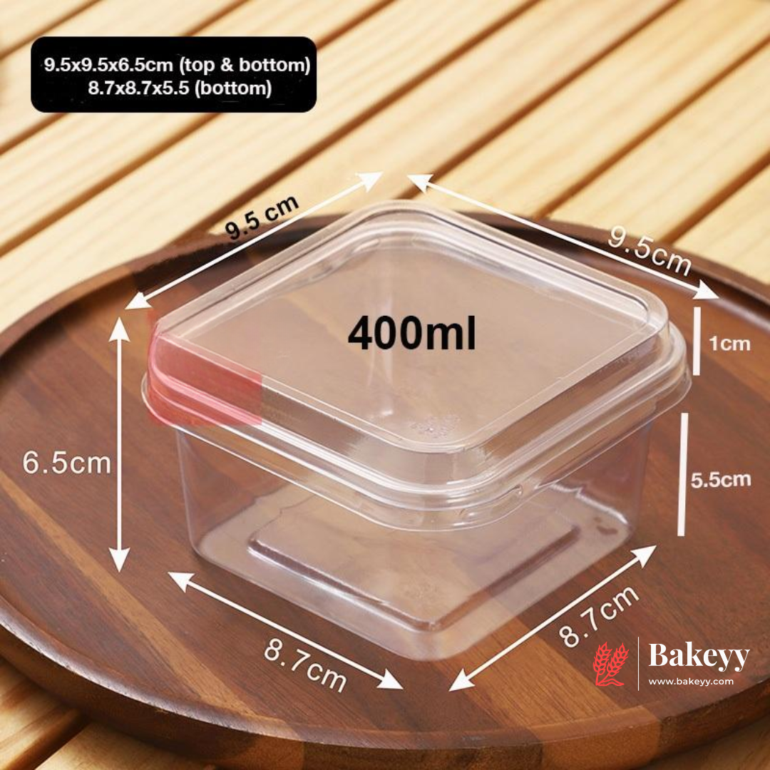 Rectangular food container with measurements on a wooden surface, featuring the Bakeyy brand.