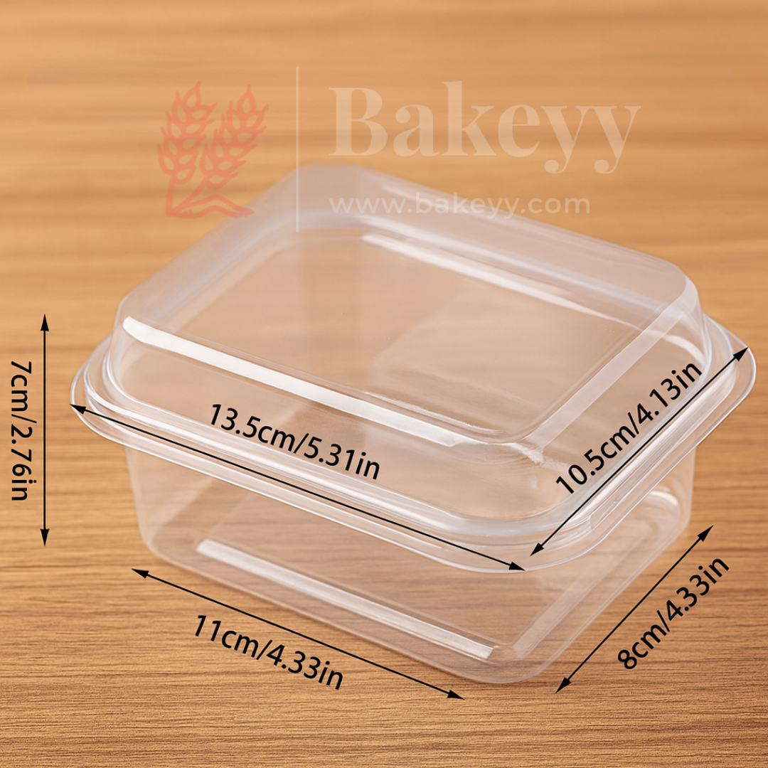Clear plastic food container with dimensions on a wooden background, featuring the Bakeyy brand.
