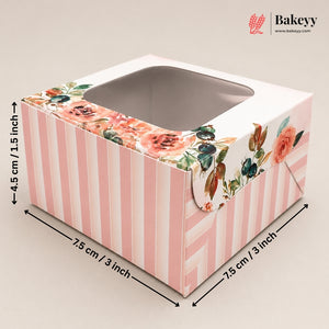 A pink and white striped bakery box with a floral print around the top window, shown with dimension arrows and labels indicating measurements of 7.5 cm / 3 inch by 7.