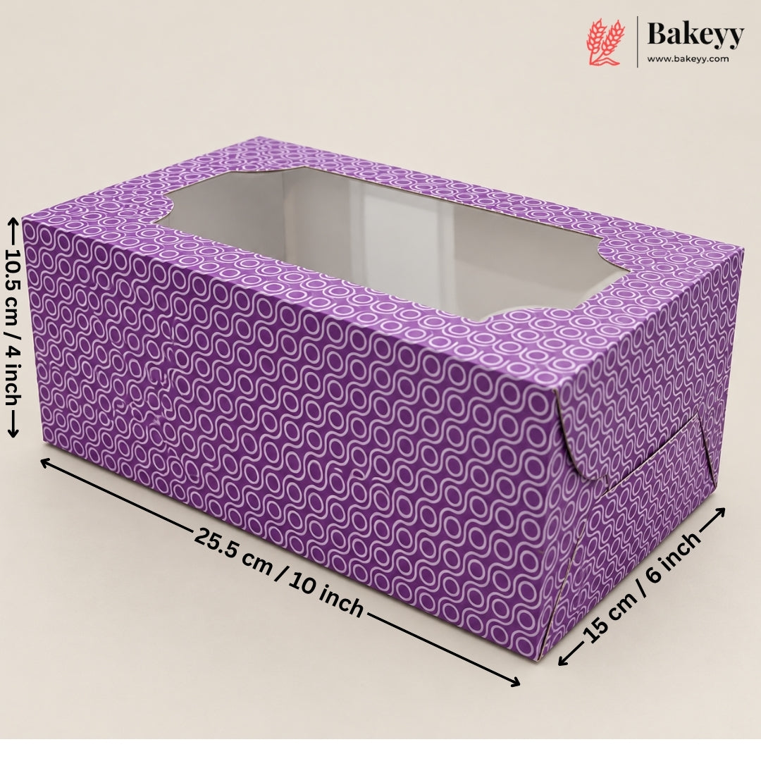 A purple patterned bakery box with a clear window, shown with dimension arrows and labels indicating 25.5 cm length, 10.