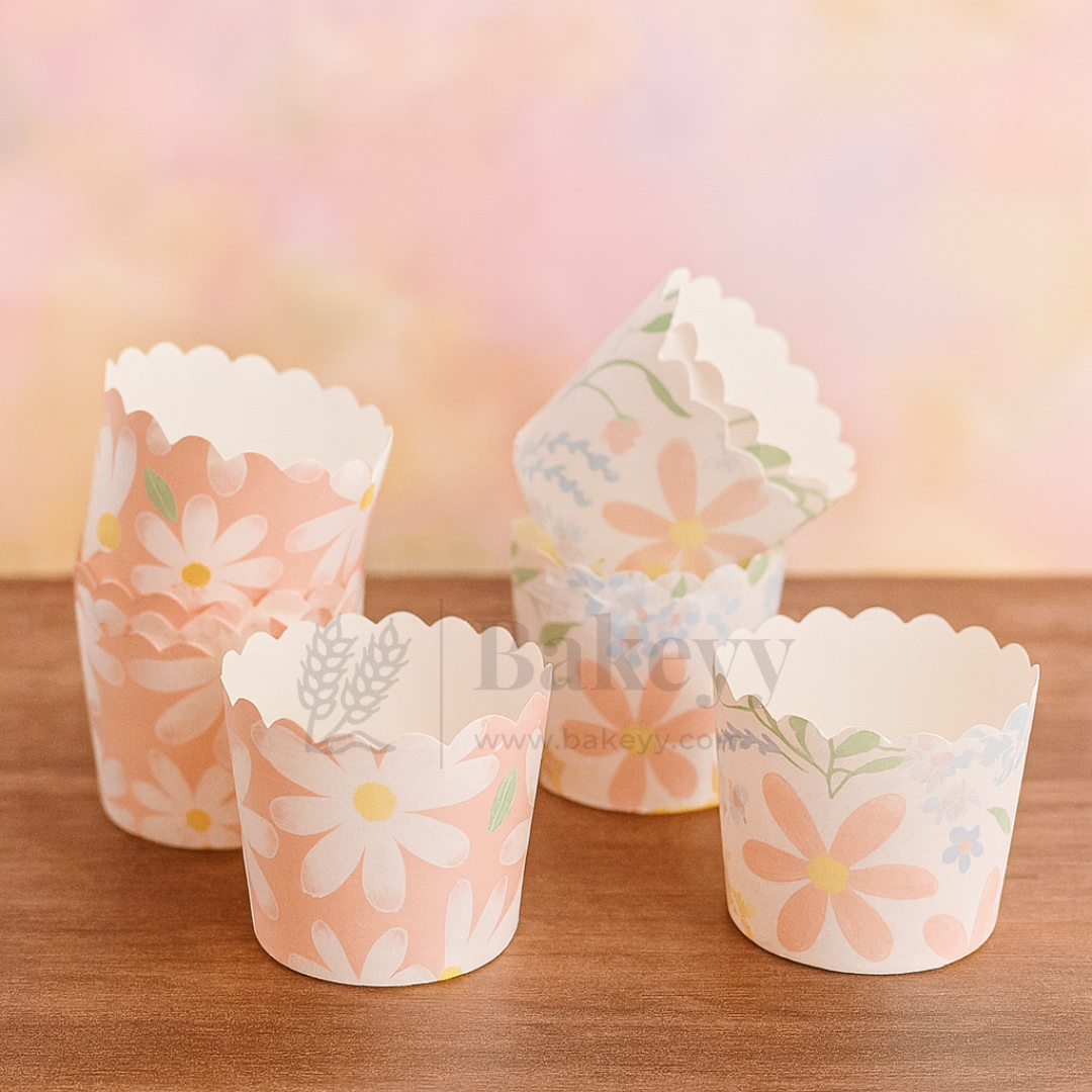Set of floral paper cupcake liners on a wooden surface with a soft, blurred background.