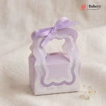 Lavender gift box with ribbon on a beige background, featuring the Bakeyy brand.