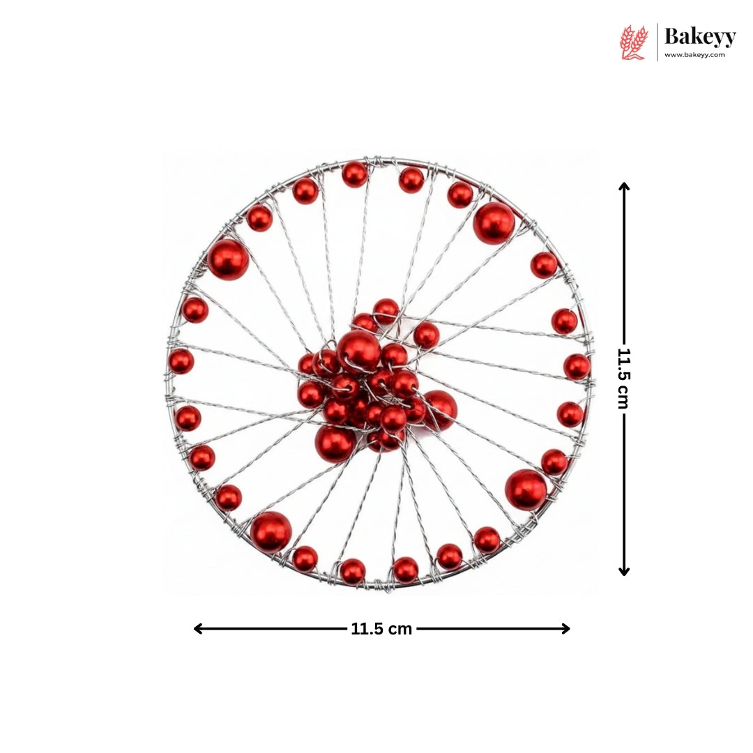 Decorative wheel with red balls and measurements on a white background