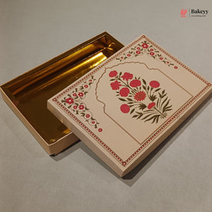 A decorative rectangular gift box with a gold interior and a cream-colored exterior lid featuring a red floral arch design, shown on a neutral gray background.