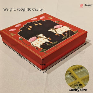 A red rectangular bakery gift box with a black central panel and hand-painted white cows with pink lotus flowers. The image includes dimension lines showing measurements of 20.