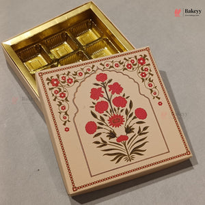 An open gold-colored bakery box with six compartments, shown next to its illustrated cream lid featuring red flowers and green leaves on a gray background.