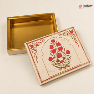 A rectangular gift box set with a cream-colored exterior lid decorated with a red floral arch motif and gold border details, shown next to an open gold-lined interior box on a light beige background.