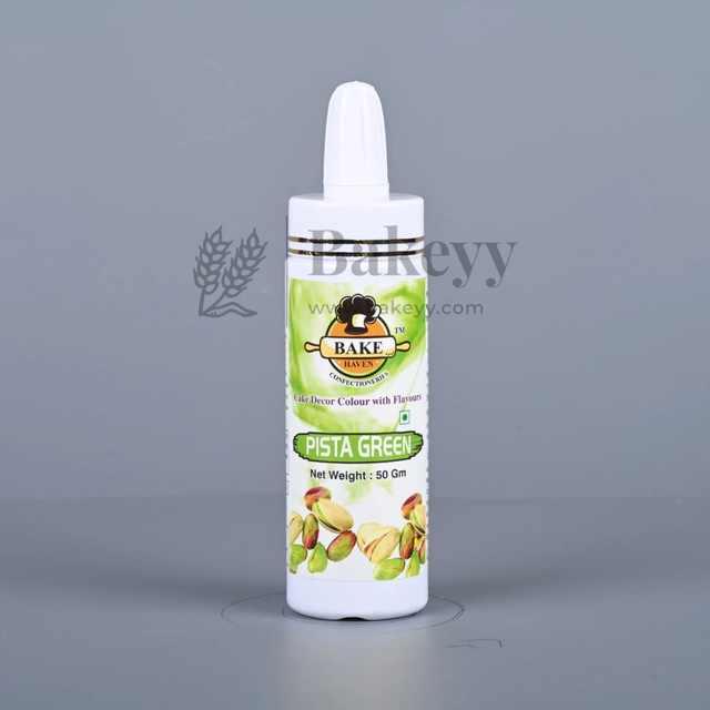 Bottle of Bakey Pista Green food color on a gray background