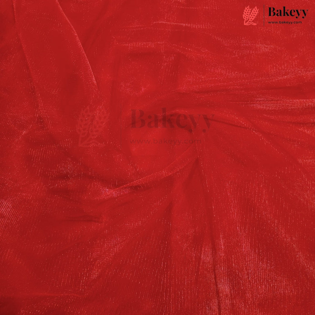 A close-up of bright red sheer mesh fabric with a textured, shimmering finish, swirled in the center. The Bakeyy brand logo is visible in the top right corner.