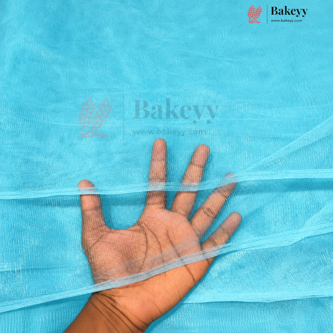 A hand is placed over a light blue sheer mesh fabric to show its texture and transparency. The Bakeyy brand logo is visible in the top right corner.