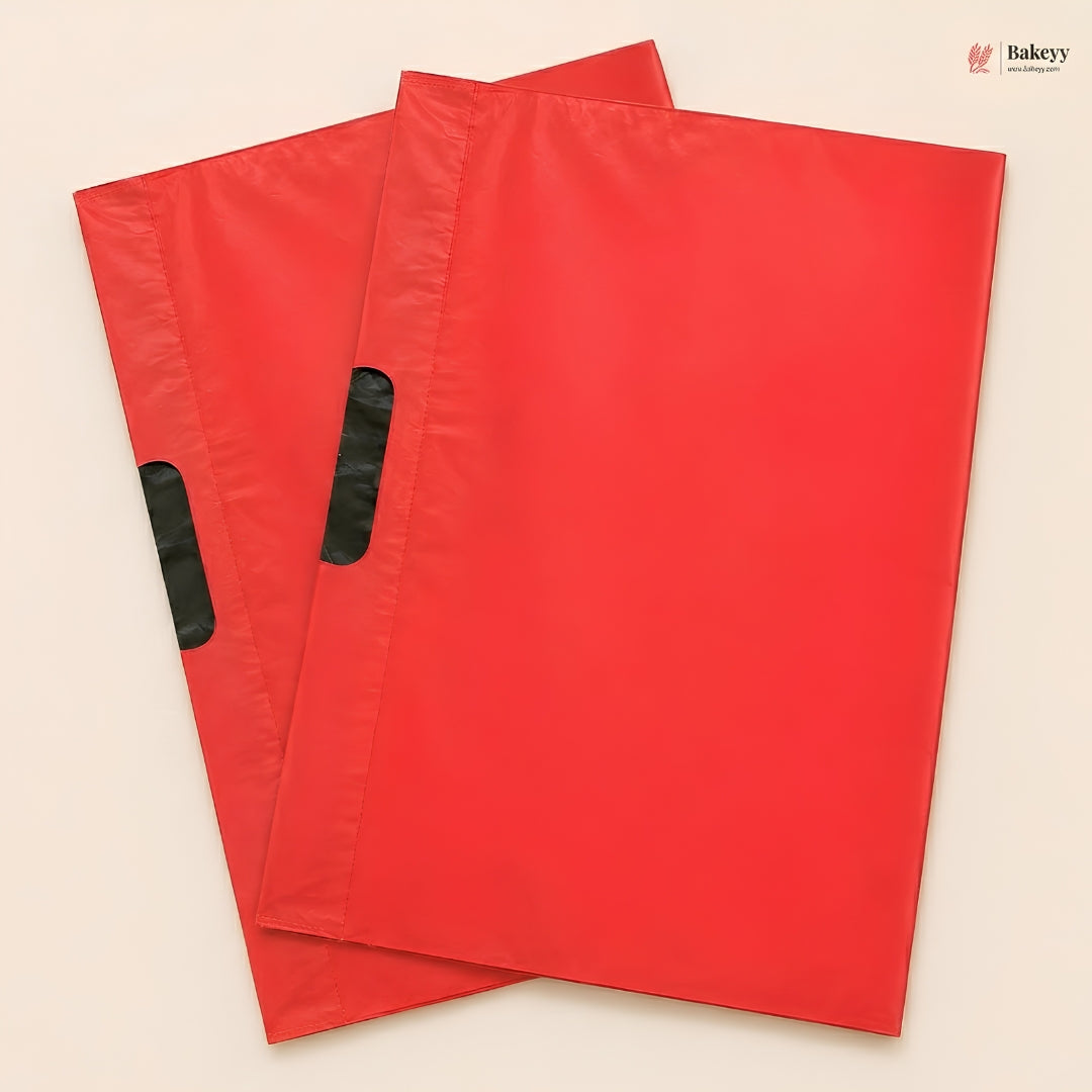 Two red envelopes with black straps on a beige background