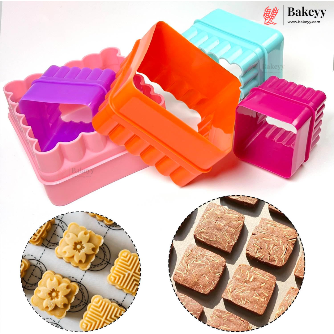 Four plastic cookie cutter molds in pink, orange, purple, and light blue, shown on a white background with circular inset photos of decorated cookies and square baked treats. The Bakeyy brand logo appears in the top right.