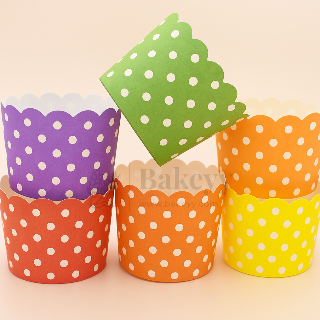 Colorful polka dot cupcake liners on a beige background