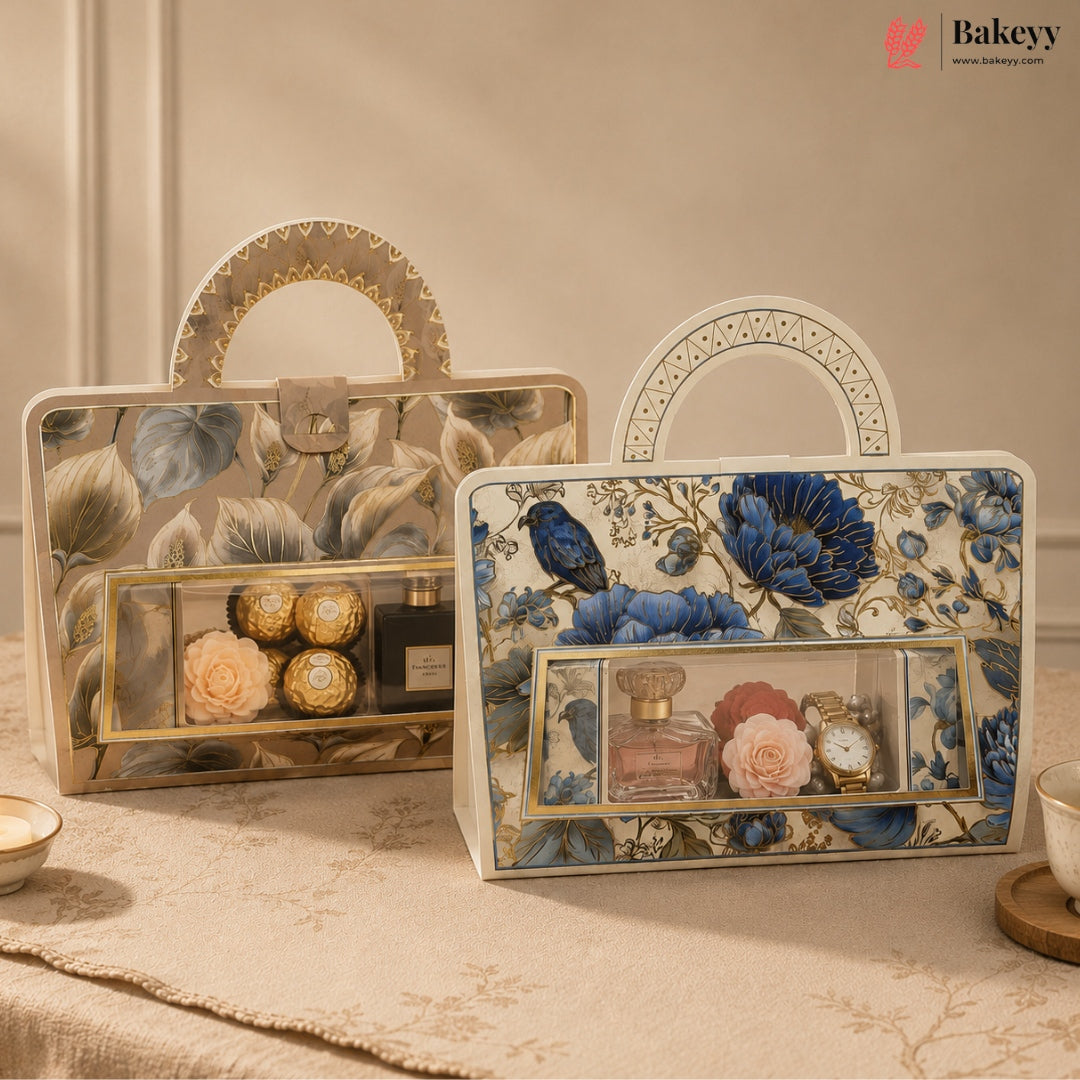 Two decorative gift boxes with floral and bird patterns, displayed on a table. One box contains Ferrero Rocher chocolates, and the other contains perfume bottles and watches.