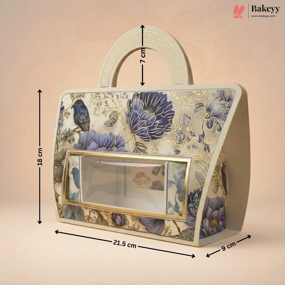 A decorative handbag-shaped product with floral and bird patterns, shown with dimension arrows and labels indicating 18 cm height, 21.5 cm width, 9 cm depth, and 7 cm handle height on a soft beige background.