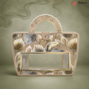 A decorative handbag with a floral pattern in beige, gray, and gold, featuring a clear front window and a curved top handle, set against a matching textured background. The Bakeyy brand logo is visible in the top right corner.