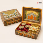 An ornate decorative gift box for sweets, shown closed and open on a light beige background. The box features intricate hand-painted architectural designs in gold, orange, and green, lined with red velvet inside.