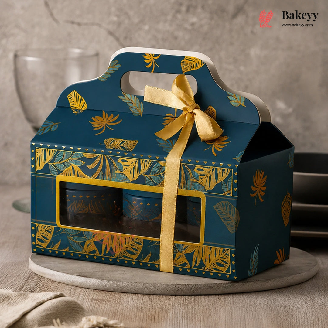 Blue gift box with yellow ribbon and leaf pattern on a neutral background