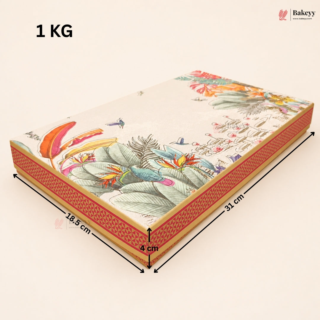 A rectangular decorative cake or gift box shown at an angle with printed tropical floral artwork on top and patterned sides. Black dimension arrows label the box as 31 cm long, 18.