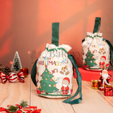 Decorative Christmas gift bags with festive designs on a wooden surface.