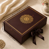 A dark brown rectangular gift box with gold decorative border and mandala design on the lid, tied with a dark brown ribbon. Black dimension arrows and text show the box measurements: 30.