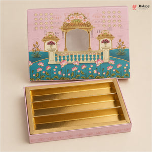 A pink decorative gift box with a gold interior, shown open with the lid placed above. The lid features an illustrated pavilion and floral design, and the box interior has five gold compartments.