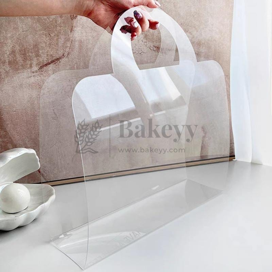 Clear acrylic cake stand with 'Bakeyy' branding on a neutral background