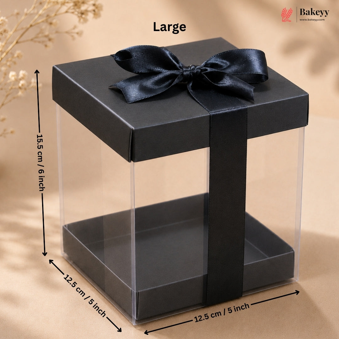 Black gift box with a bow and measurements on a beige background