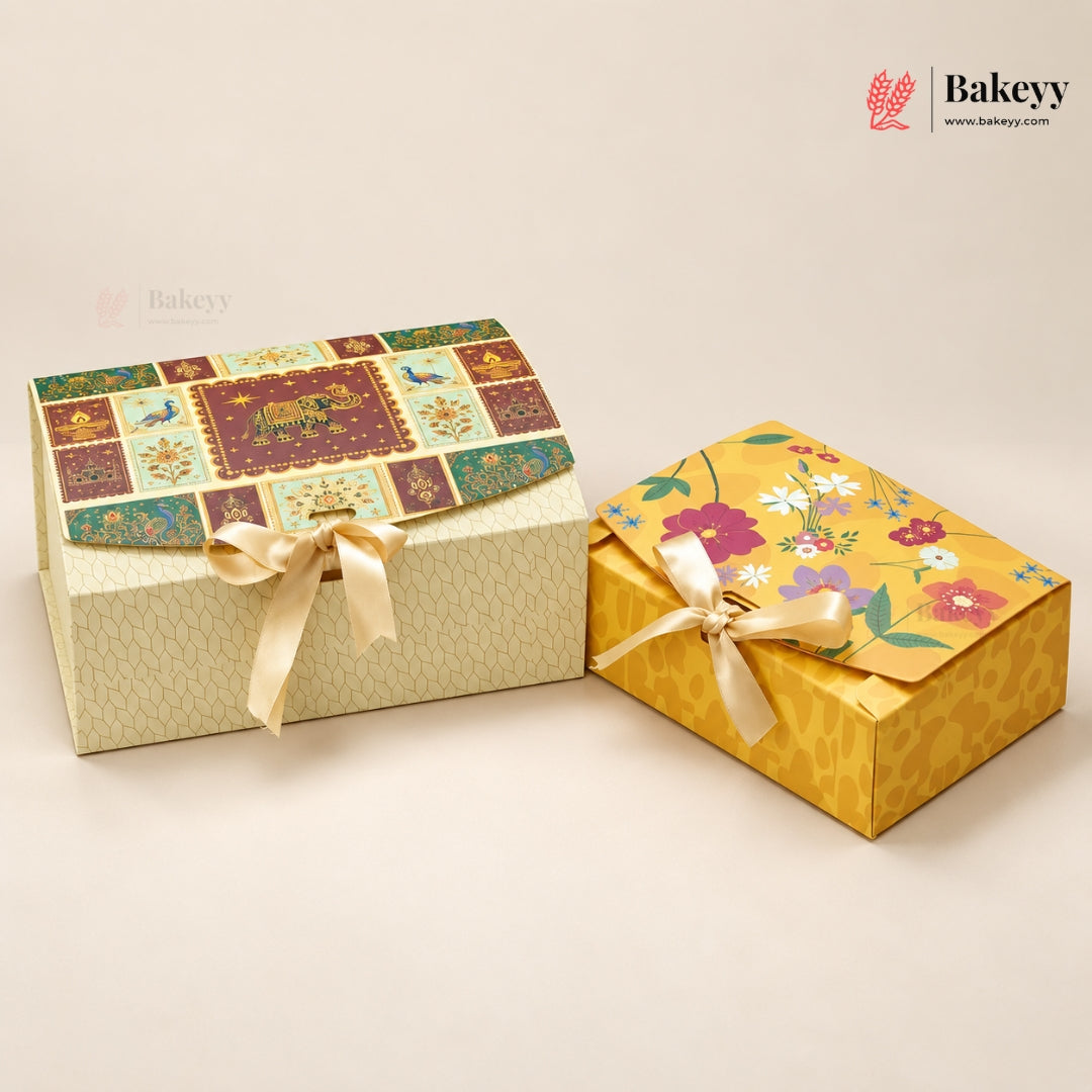 Two decorative gift boxes from Bakeey on a warm off-white background. The larger box on the left has a patchwork floral lid with a cream patterned base and a cream ribbon bow.