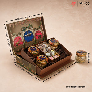 An open decorative gift box filled with assorted packaged sweets and jars, shown with dimension arrows and text indicating measurements. A small matching jar sits to the right on a warm beige textured background.