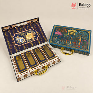 An ornate rectangular gift box set shown on a light beige studio background. One box is open, revealing four glass jars with gold-toned lids and decorative navy lining; the other box is closed, showing a colorful illustrated floral and tree design on the lid.