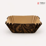 Decorative brown paper cake board with intricate patterns on a white background, featuring the Bakeyy brand.