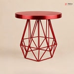 Red geometric side table on a beige background