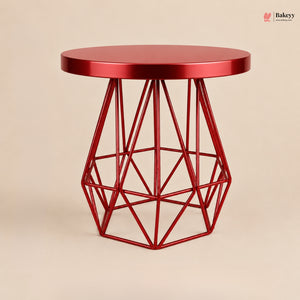 Red geometric side table on a beige background