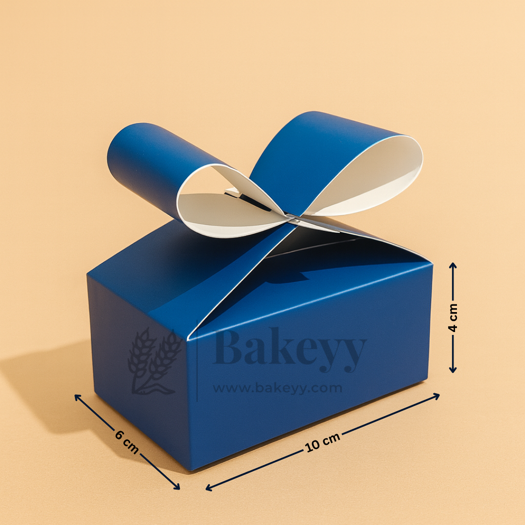 Blue gift box with a ribbon on a beige background, featuring the brand 'Bakeyy'.