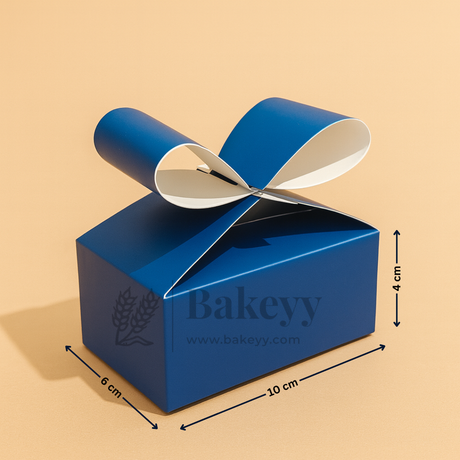 Blue gift box with a ribbon on a beige background, featuring the brand 'Bakeyy'.