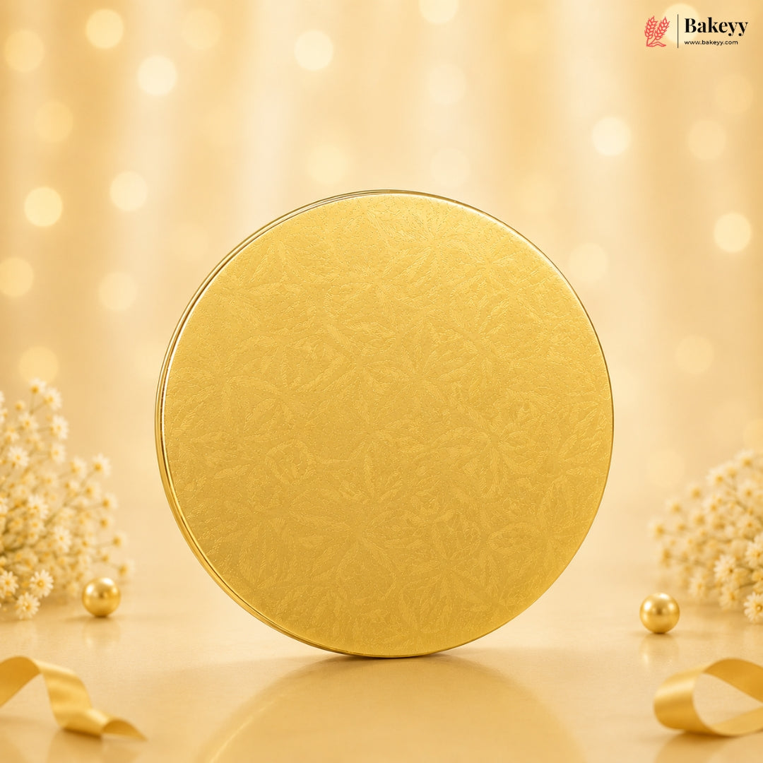 Gold circular object on a beige background with decorative elements